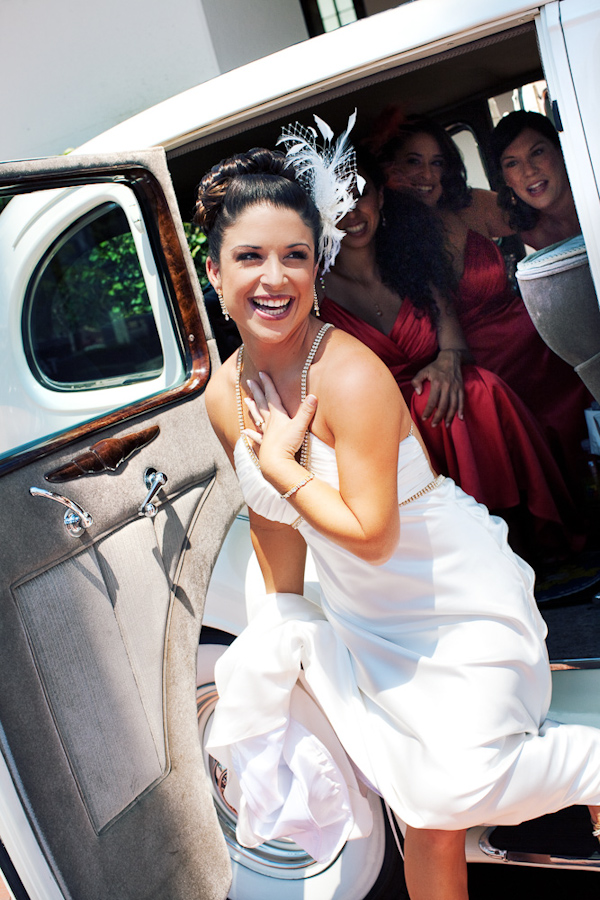 the beautiful bride posing with her bridesmaids waiting in the car - photo by Southern California wedding photographers Callaway Gable